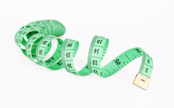 Measuring tape on a white photo