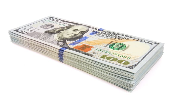 Stack of dollars on a white back photo