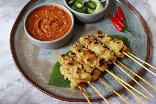 Pork satay grilled skewer with peanut sauce. photo