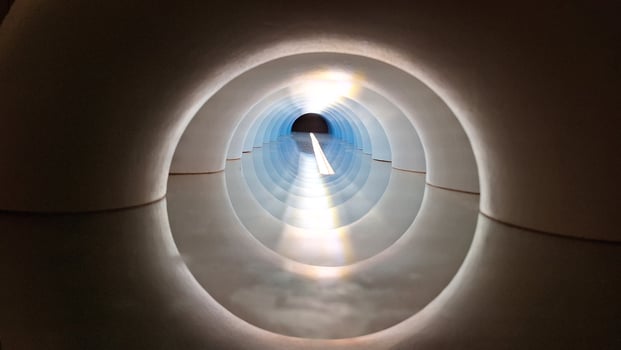 Abstract perspective inside circular tunnel with light reflections photo