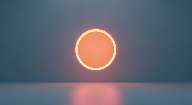 Abstract glowing orange circle on a blue wall with a reflective surface photo