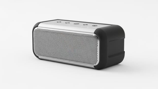 A black and white portable speaker on a white surface uniquely crafted for your design needs photo
