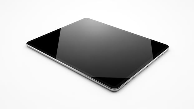 A black tablet computer on a white surface photo