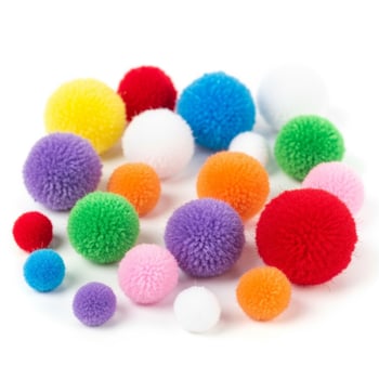 A pile of colorful pom poms on a white surface photo