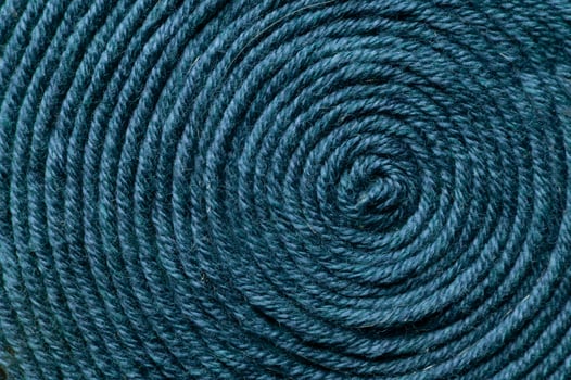 Blue knitted fabric texture as background, top view photo