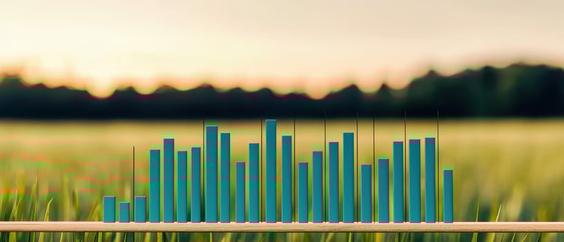 Financial infographic with dividend yield growth chart displayed on wooden stick in green field at sunset photo