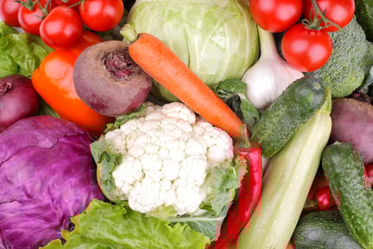 Many different vegetables include beets, cabbage, zucchini, carrots, tomatoes, peppers and cucumbers. Background. top view photo