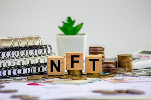 NFT A unit of digital ledger storage, or blockchain, that guarantees that a digital asset is unique and therefore non-fungible. photo