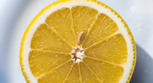 A vibrant close-up showcasing the juicy texture and refreshing look of a half cut lemon photo