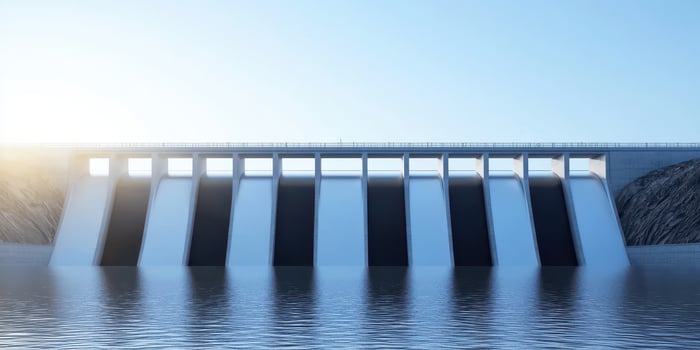 Massive hydroelectric dam producing clean energy and water flow photo