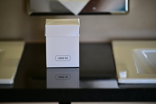 White Cardboard Comfort Box Placed on Wooden Table in a luxury hotel in Luebeck germany photo