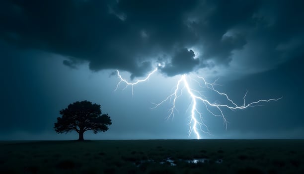 Dramatic Lightning Strike Illuminating a Lone Tree in a Dark Stormy Landscape photo
