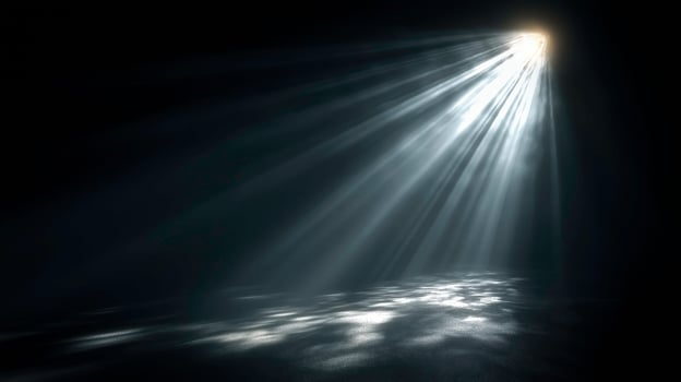 Dramatic Light Beam Piercing Darkness Over Water Scene photo