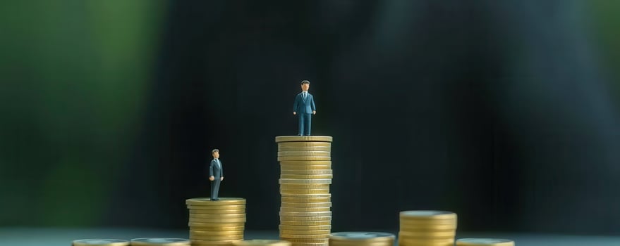 Miniature figures coin towers illustrating financial growth photo