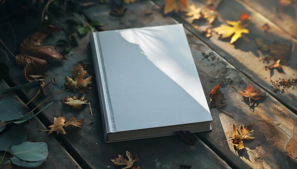 Mockup with book cover template on wooden floor background with autumn leaves photo