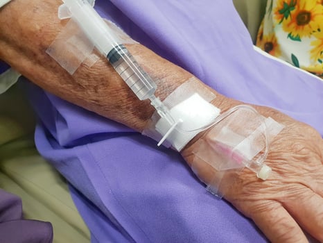 A woman with a drip on her arm photo