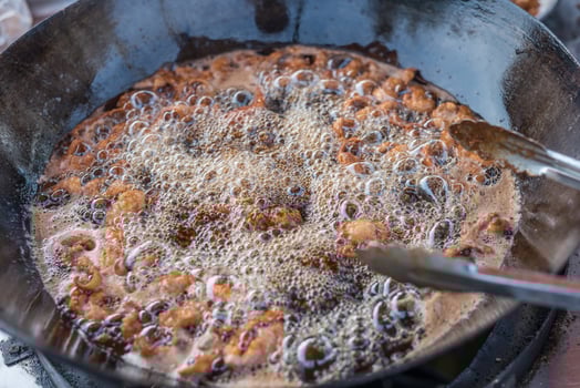 A pan with food in it and a spoon photo