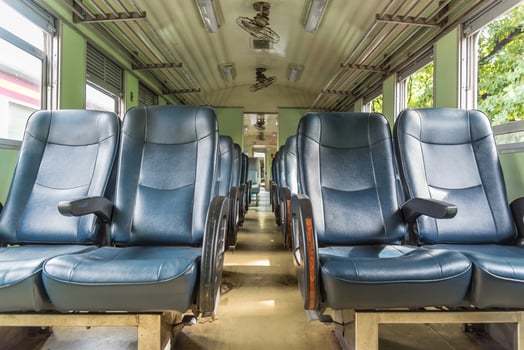 The interior of a train with blue seats photo