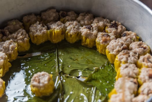 A pan filled with food that is being cooked photo