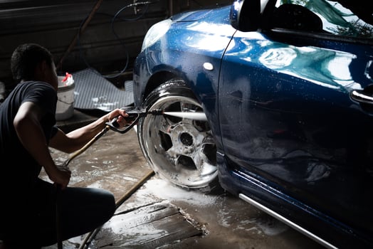 A man is washing a car photo