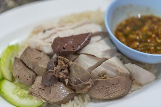 A plate of food with meat, rice and vegetables photo