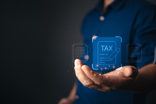 A businessman presents a futuristic digital tax document interface with glowing icons, symbolizing online tax filing, financial management, electronic taxation, and secure digital transactions. photo