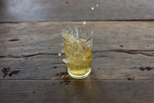 Beer spread with ice in glass photo