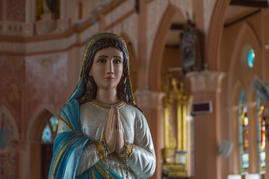 A statue of mary in a church photo