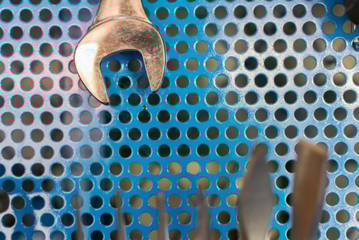 A close up of a set of tools on a blue surface photo