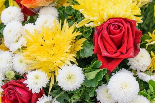 Yellow and red flower in a bouquet photo