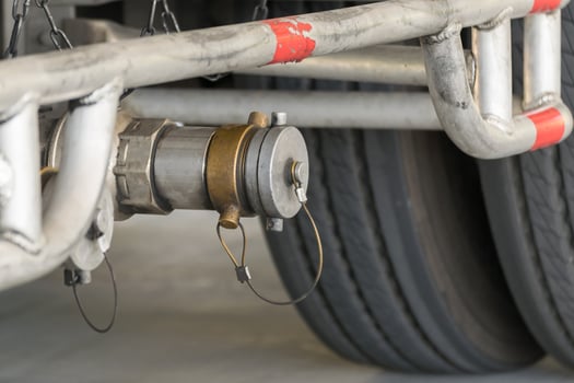 A close up of a truck's wheel and axle photo