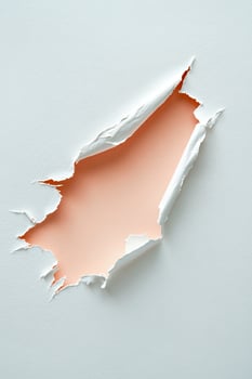 Angled view shows a textured white paper ripped to reveal a coral color photo