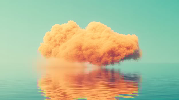Golden cloud rests gently above rippling ocean water creating a mirrored reflection effect below photo