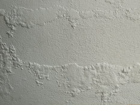 Rough cement wall texture with gradient lighting and soft focus. photo