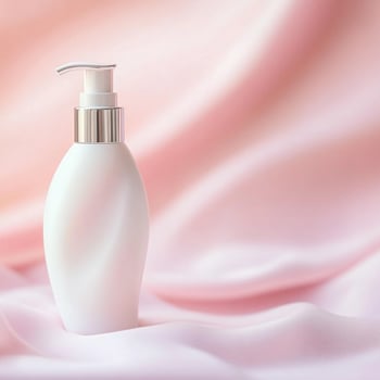A bottle of cosmetic cream on a pink background photo