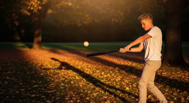 Gen Z baseball practice in golden hour light showcasing youthful athletic activity and vibrant photo