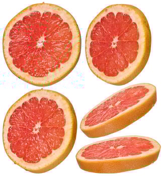 Round grapefruit slices with juicy pulp on an isolated background in different angles on an isolated background photo