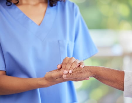 Gentle Support Between Caregiver and Elder in a Bright, Calming Setting photo