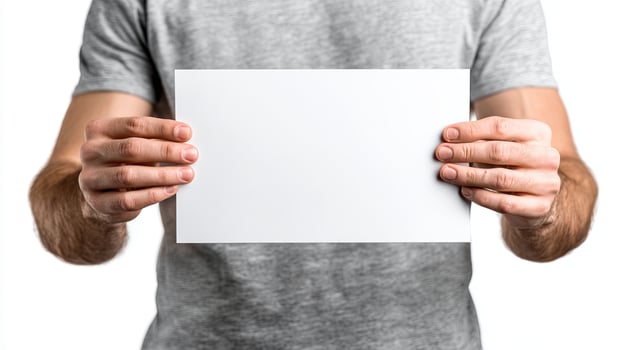 Man holding blank paper in front of him photo