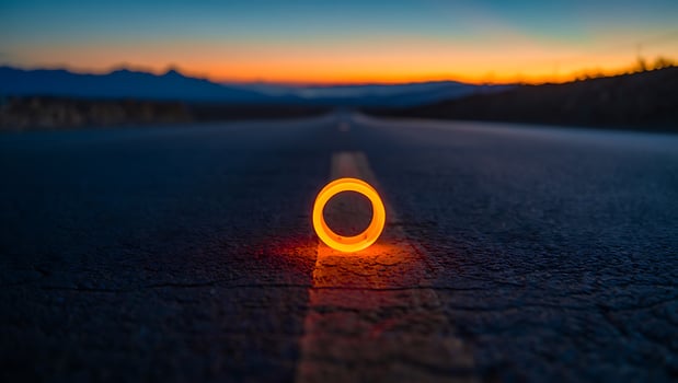 Glowing Ring on Lonely Road at Dusk Symbolic Journey of Self Discovery and Inner Peace photo