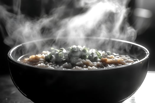 Hot Steaming Bowl of Rice with Green Onion and Savory Broth photo