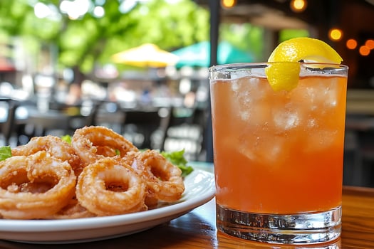 Crispy Fried Calamari Rings With a Refreshing Citrus Drink. photo