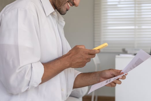 business male use phone to scan barcode or QR codes to pay credit card bill after receiving document invoice online. payment, receive, paying electricity, digital payments without money, technology photo