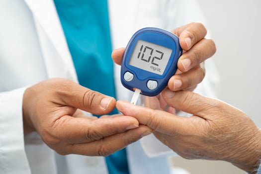 Doctor check diabetes finger blood sugar photo