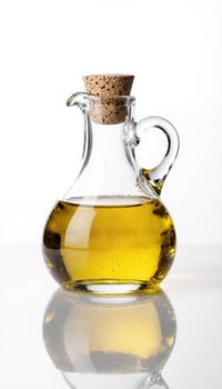 Glass Oil Dispenser on Reflective Surface photo