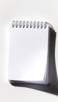 Spiral Notebook on White Surface photo