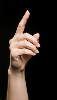 Hand Gesture Against Black Background photo
