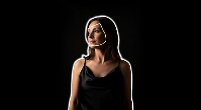 Beautiful Woman in Black Dress with White Outline of Face on Black Background photo