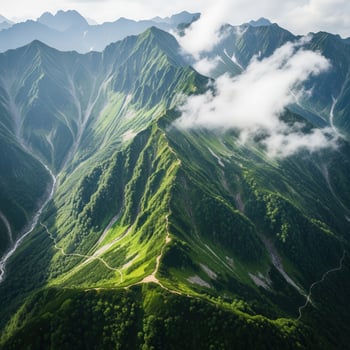 Aerial view of a lush green mountain range with dramatic valleys photo