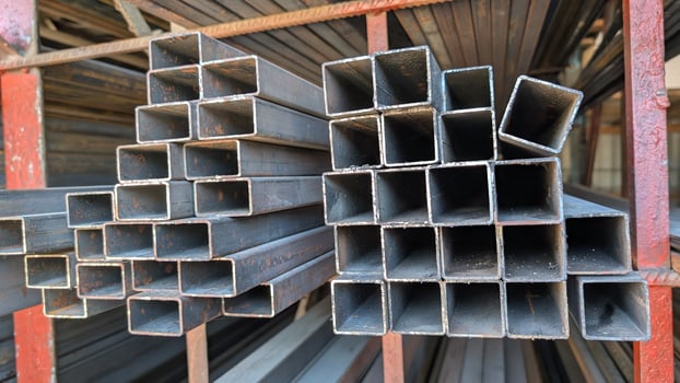 Stacked Steel Pipes in an Industrial Setting showcasing robust steel elements in assembly photo